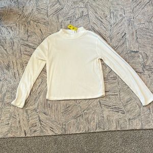 Cream Tilly’s long sleeve turtleneck